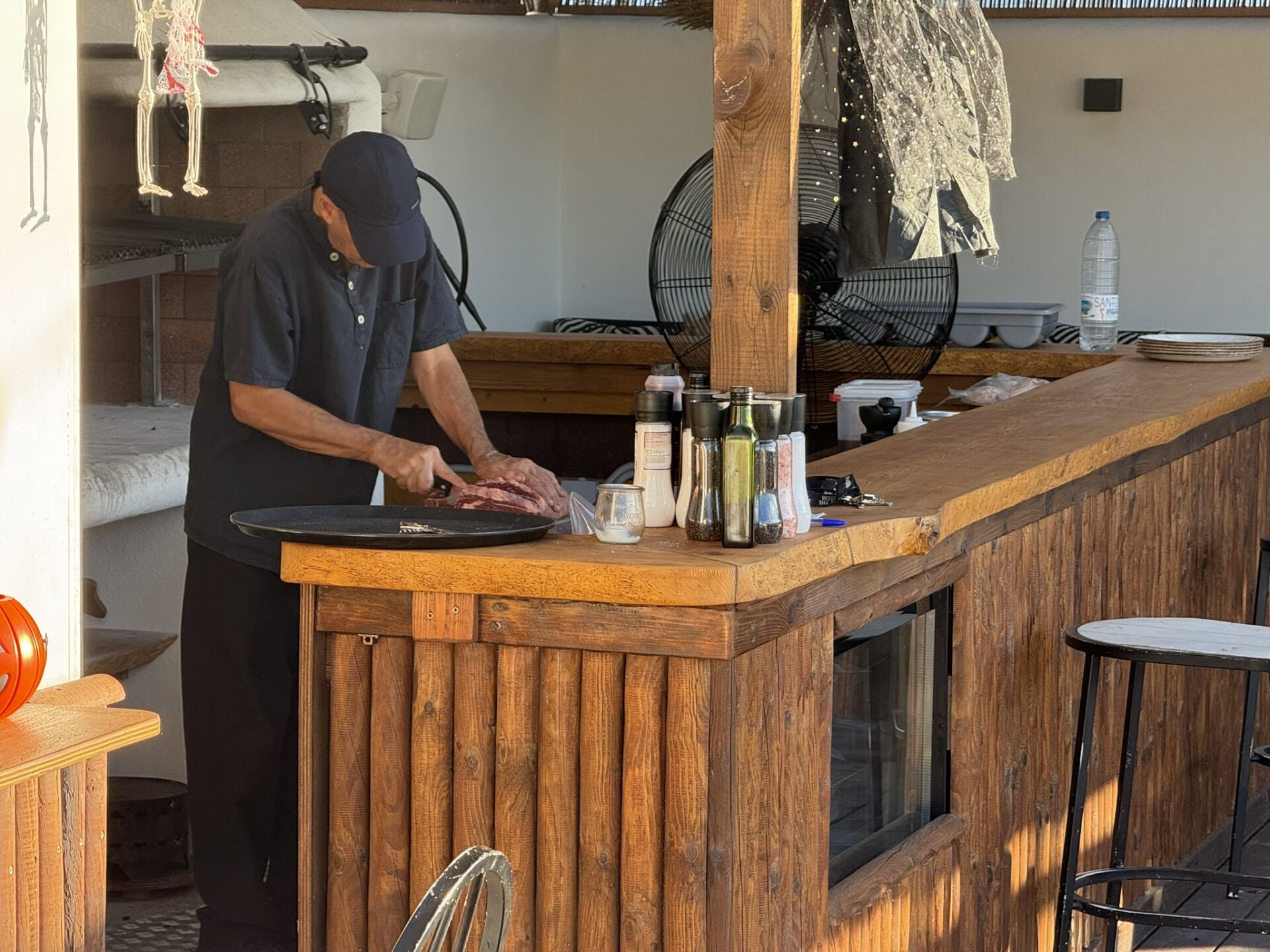 Can Bestia chef preparing meat at the open counter